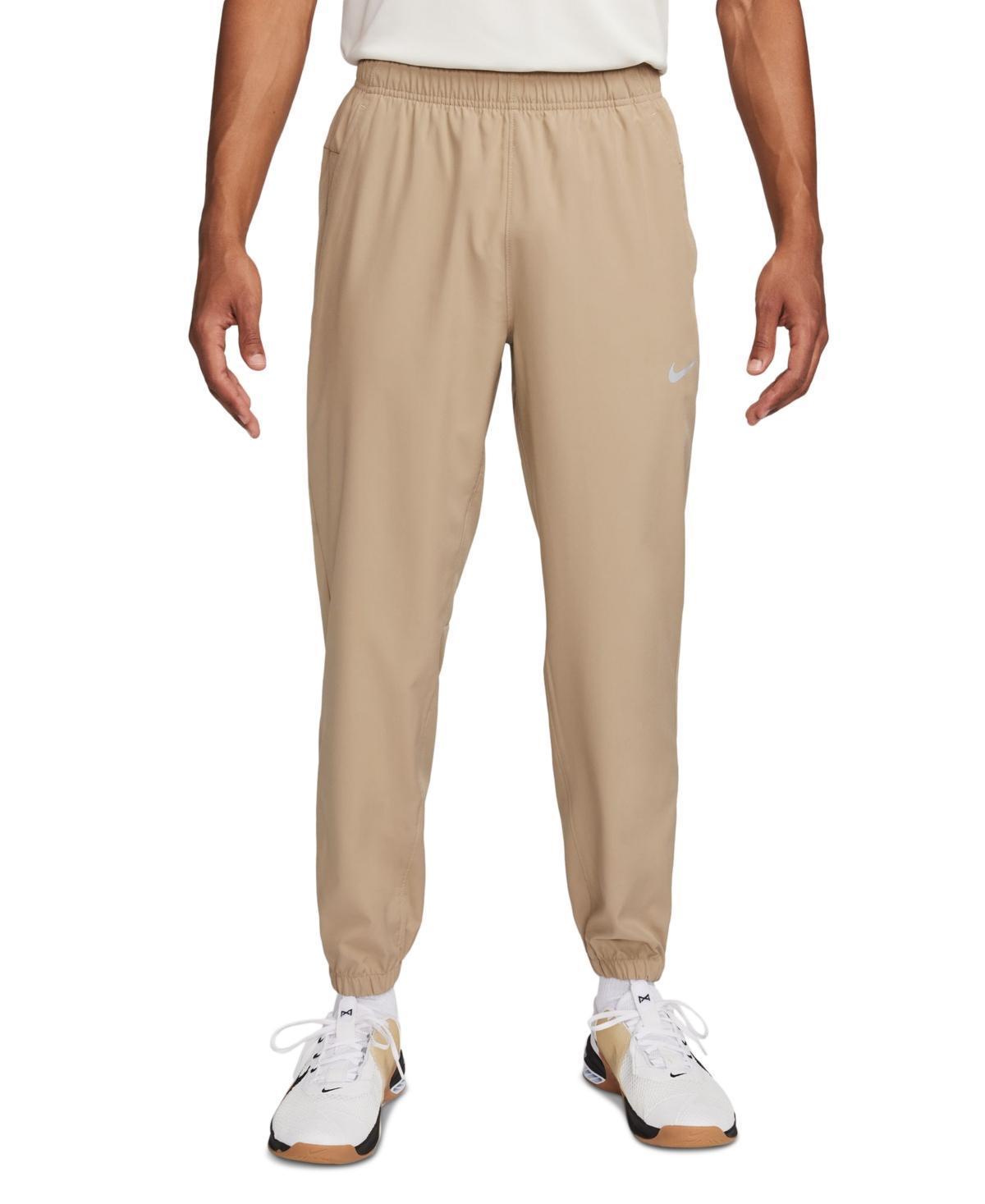 Nike Men's Form Dri-FIT Tapered Versatile Pants in Grey/Smoke Grey Size Large 100% Polyester Product Image