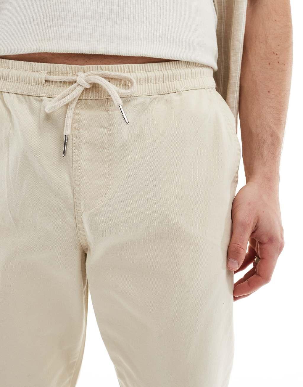 ASOS DESIGN slim pull on pants in beige Product Image