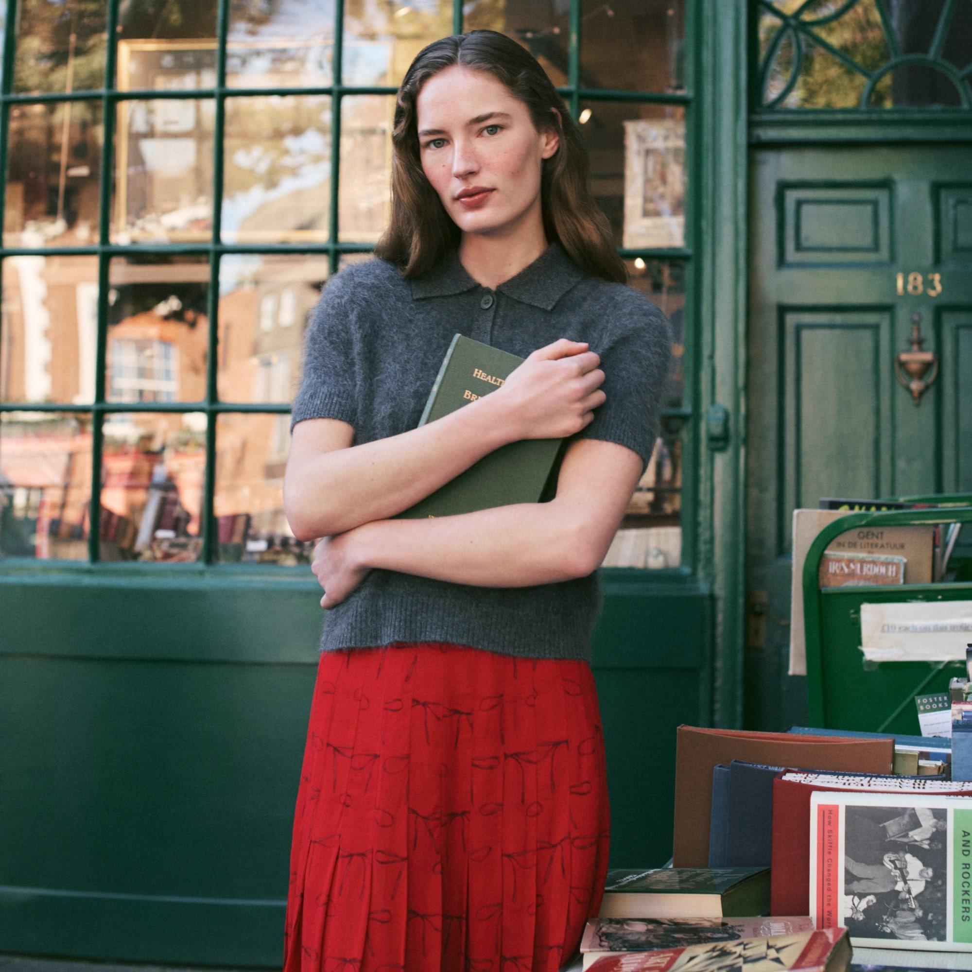 Pleated knee-length skirt in bow-print viscose chiffon Product Image