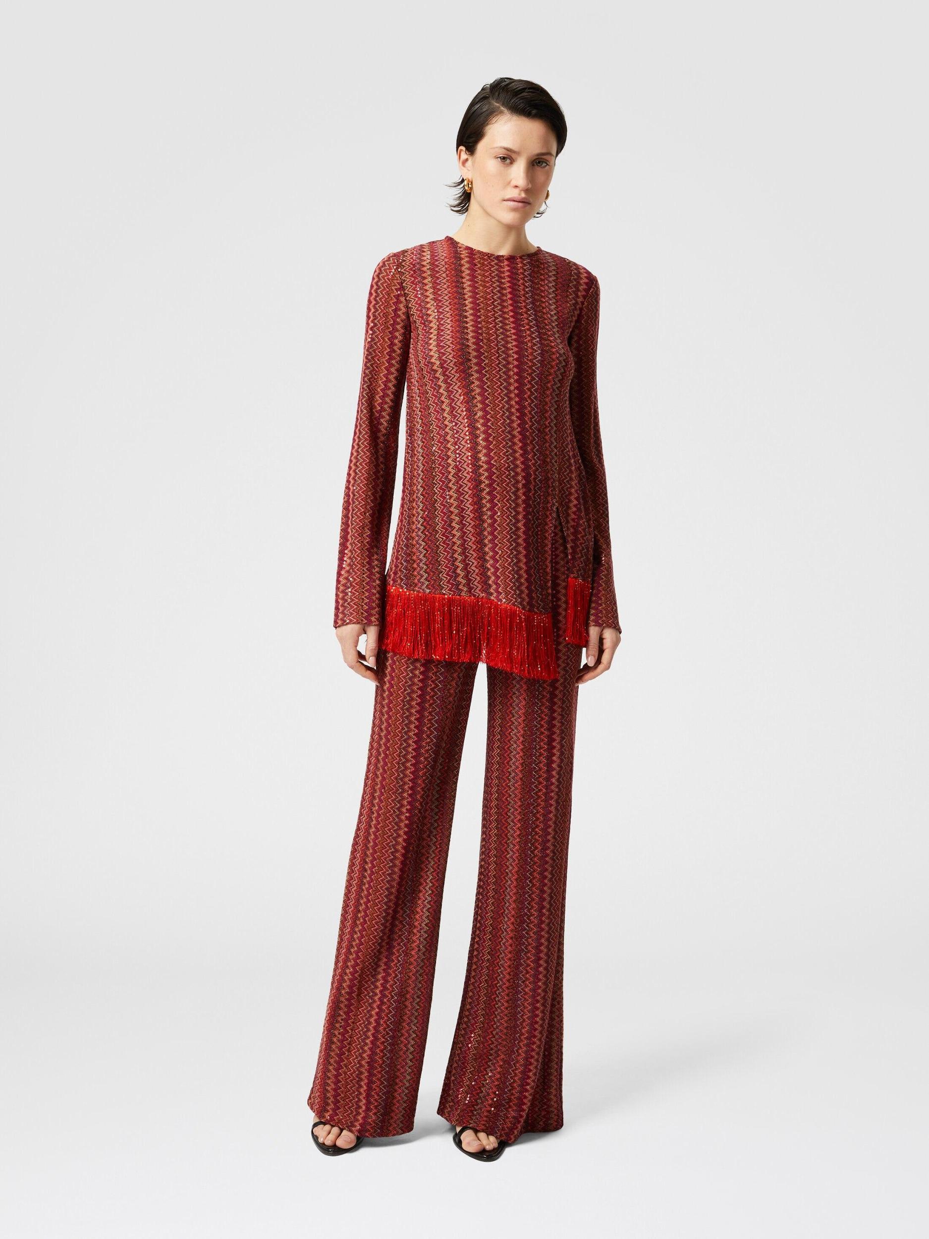 Zig zag sweater with sequins and asymmetrical hem with fringes Product Image