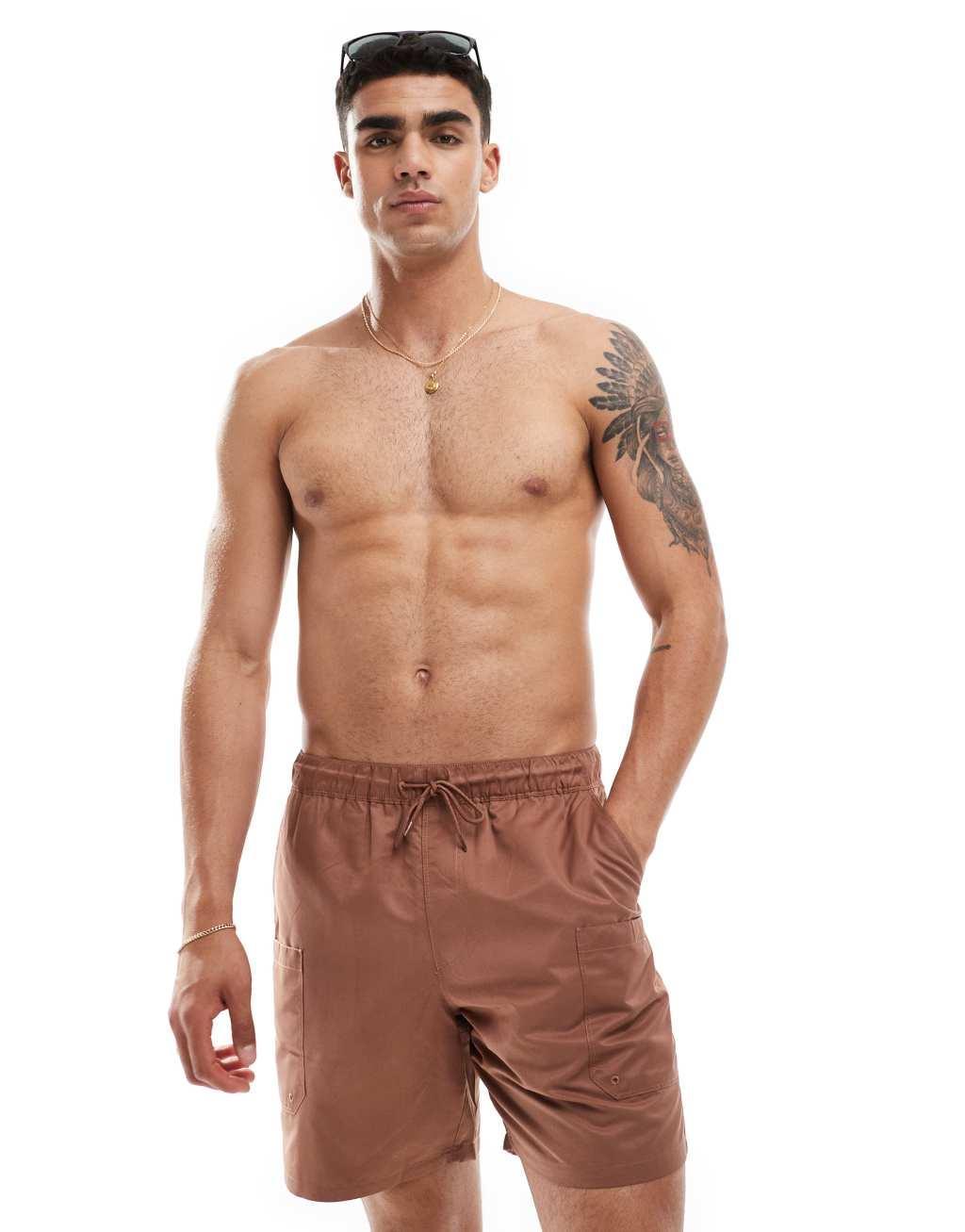 ASOS DESIGN swim shorts in mid length with cargo pocket detail in brown Product Image