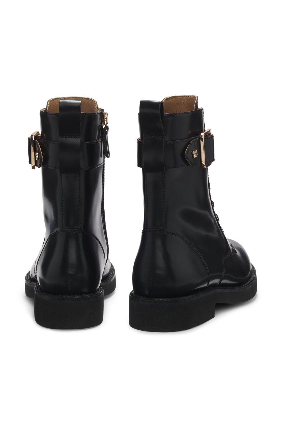 Leather boots with buckle detail Product Image