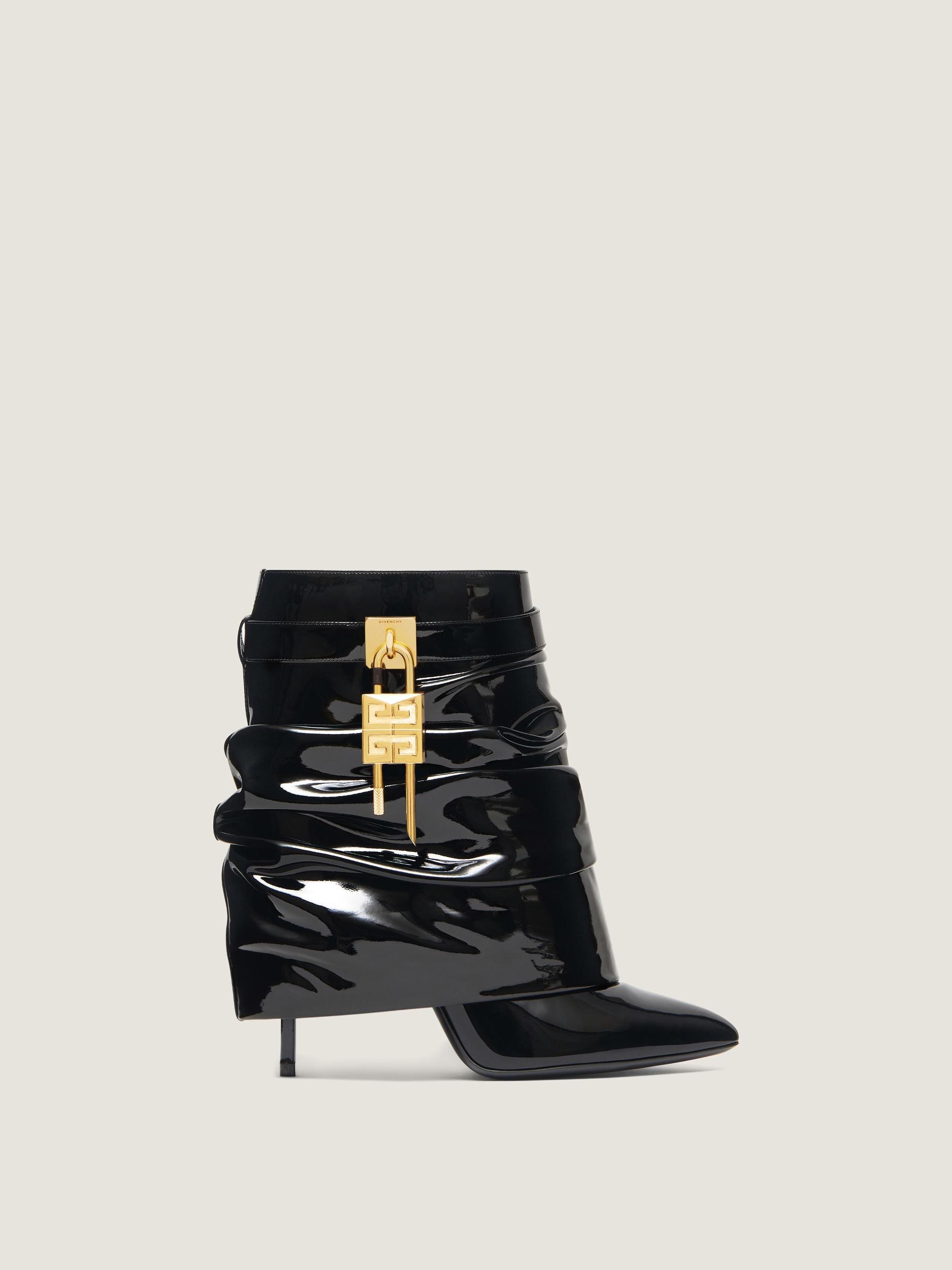 Shark Lock Stiletto ankle boots in latex Product Image