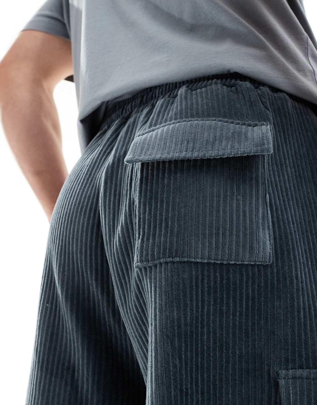 ASOS DESIGN oversized ribbed velour shorts in gray with cargo pockets Product Image