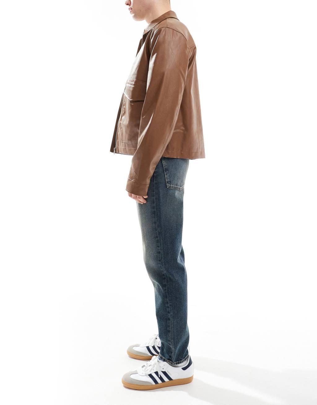 ASOS DESIGN tapered fit jeans in mid wash blue with tint  Product Image