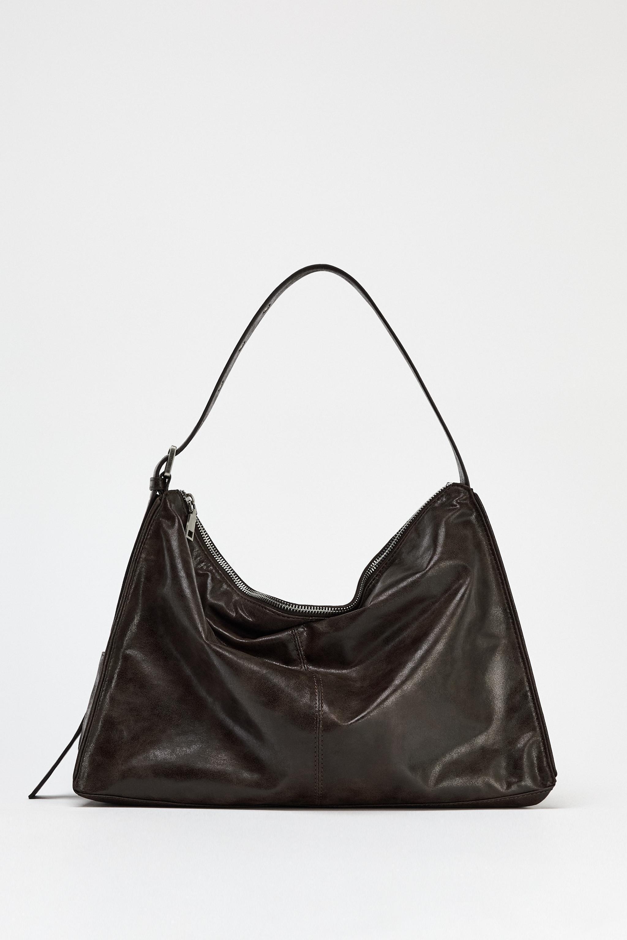 LARGE SOFT BUCKET BAG WITH METAL EYELETS Product Image