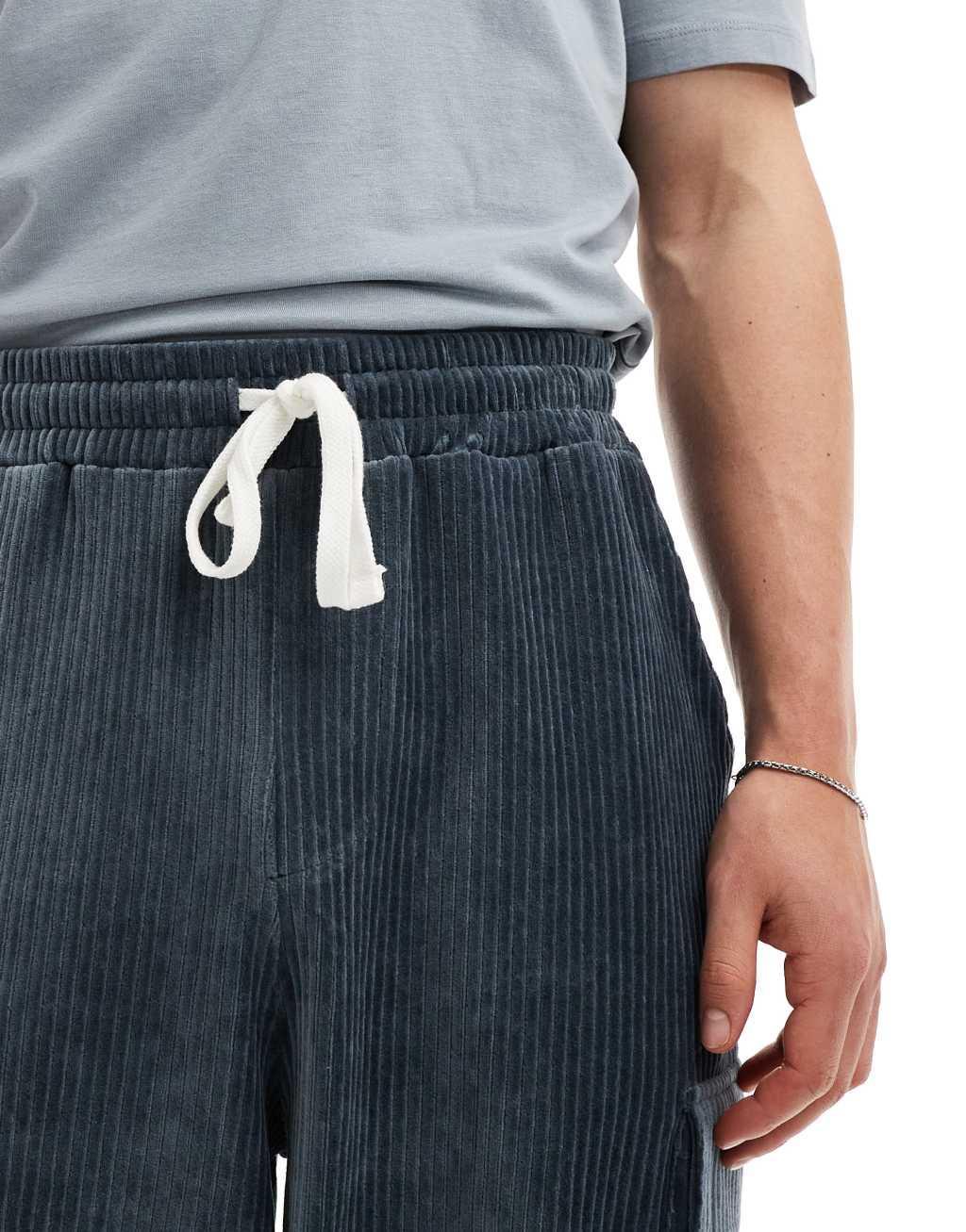 ASOS DESIGN oversized ribbed velour shorts in gray with cargo pockets Product Image