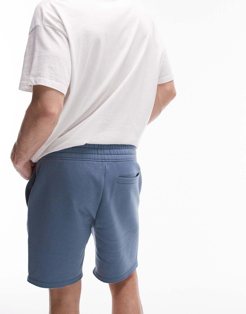 Topman classic fit jersey shorts with raw hem in blue Product Image