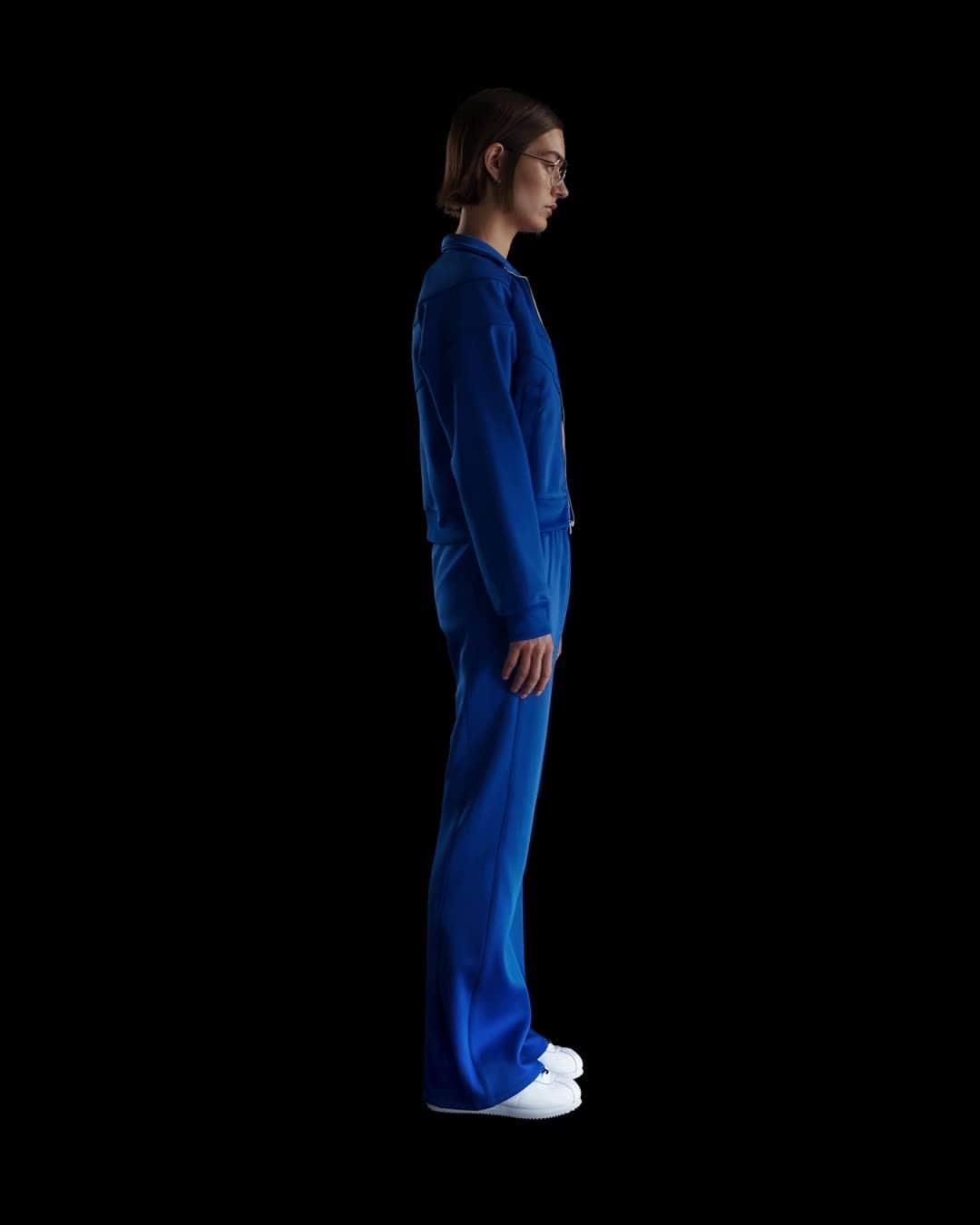 Women's Nike Sportswear Windrunner Mid-Rise Slim Knit Pants Product Image