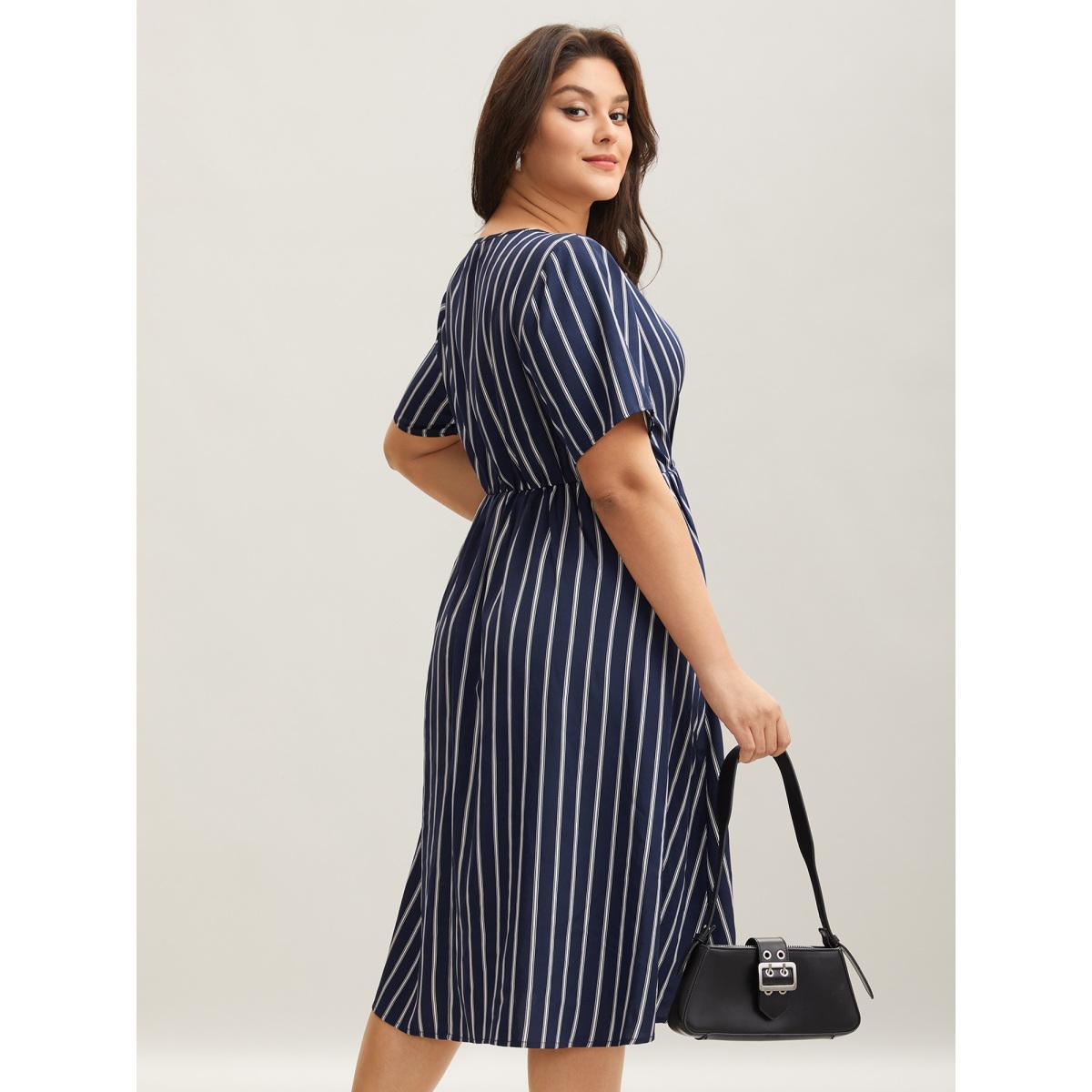 Plus Size Striped Stretchy Waist Defining Pockets Dress Indigo Women At the Office Pleated Round Neck Short sleeve Curvy BloomChic 26/4X Product Image