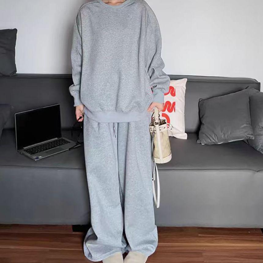 Set: Round Neck Plain Pullover + Mid Waist Wide Leg Pants Product Image
