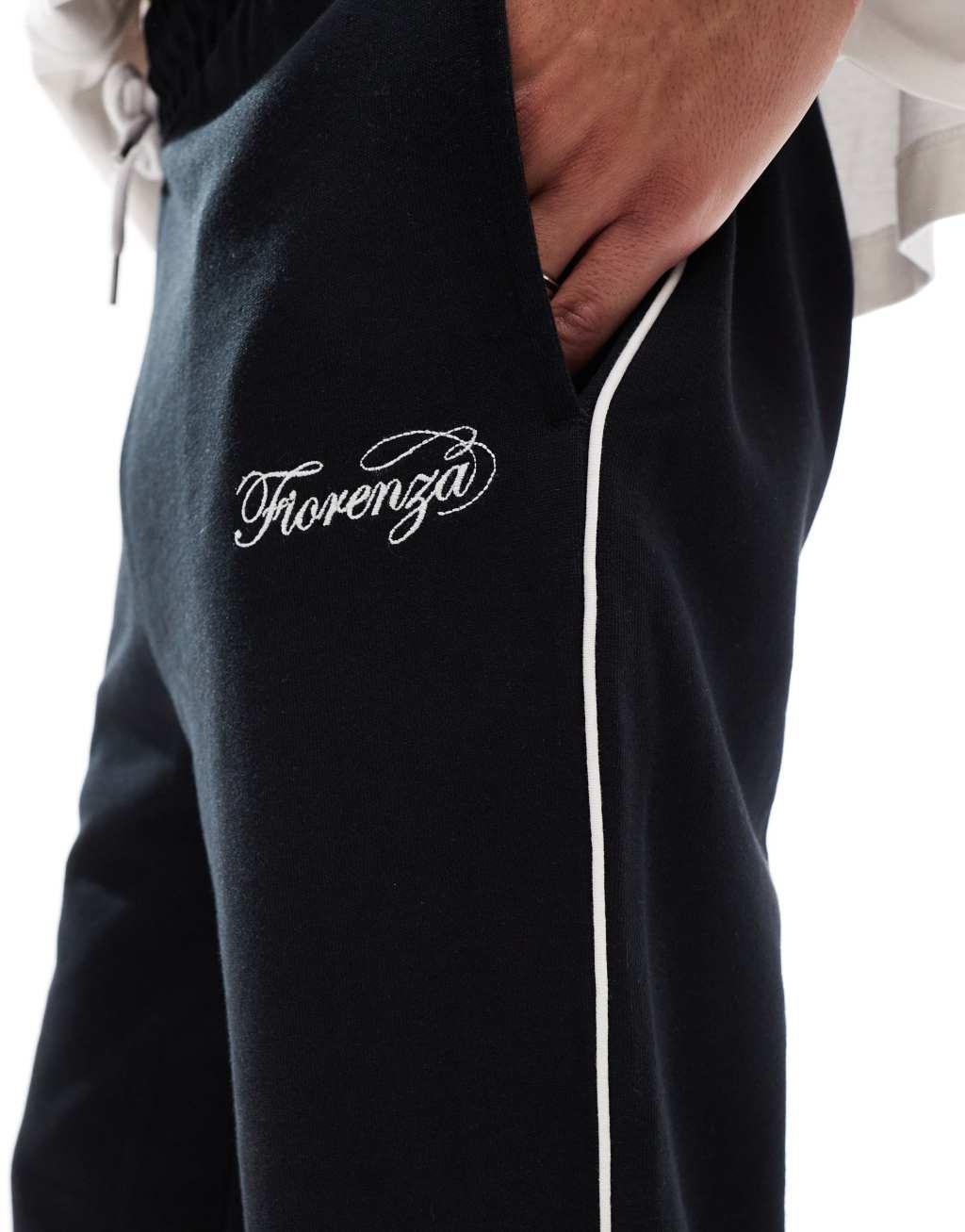 ASOS DESIGN straight leg sweatpants with embroidery and tipping details in black Product Image