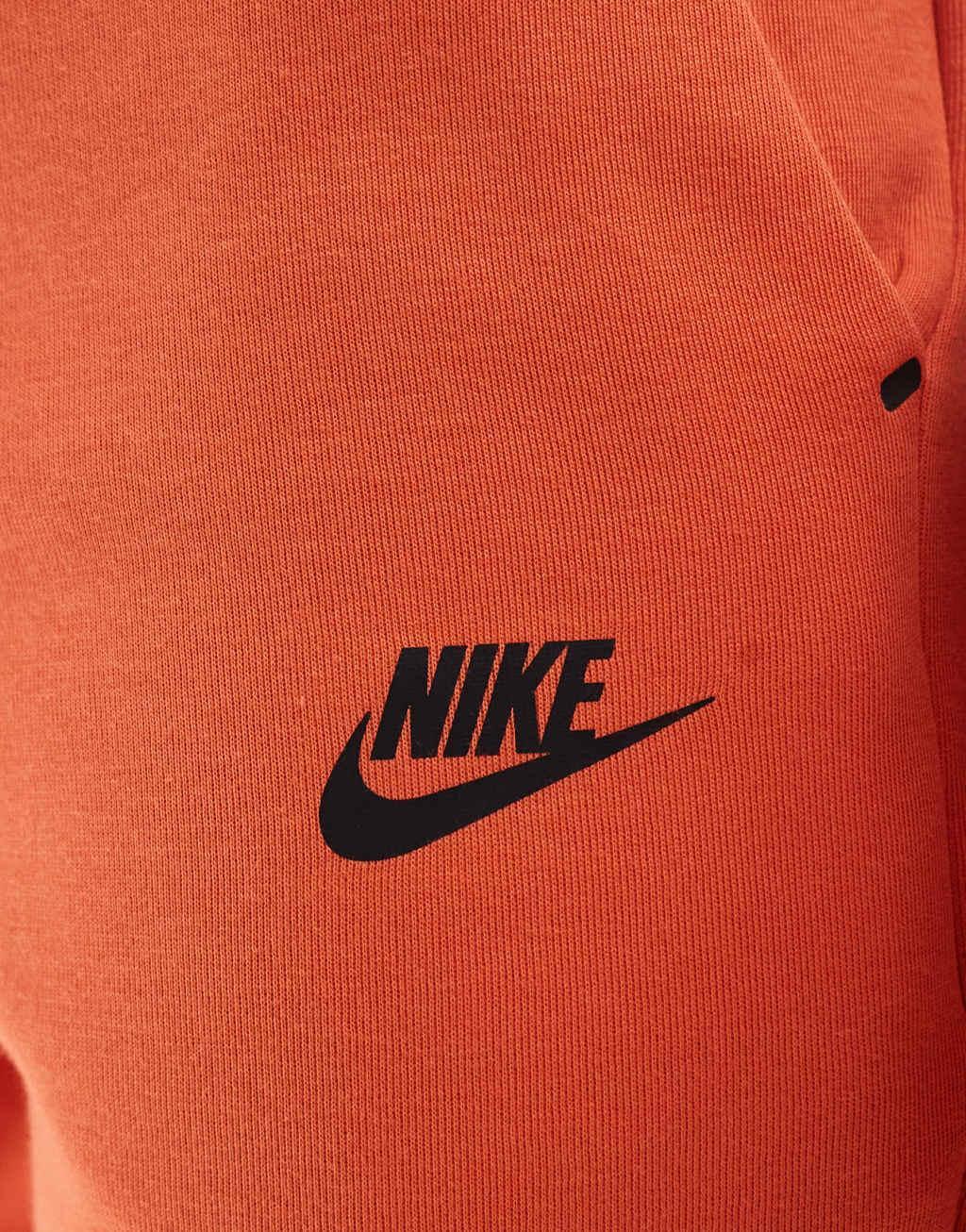 Nike Tech Fleece cuffed sweatpants in orange Product Image