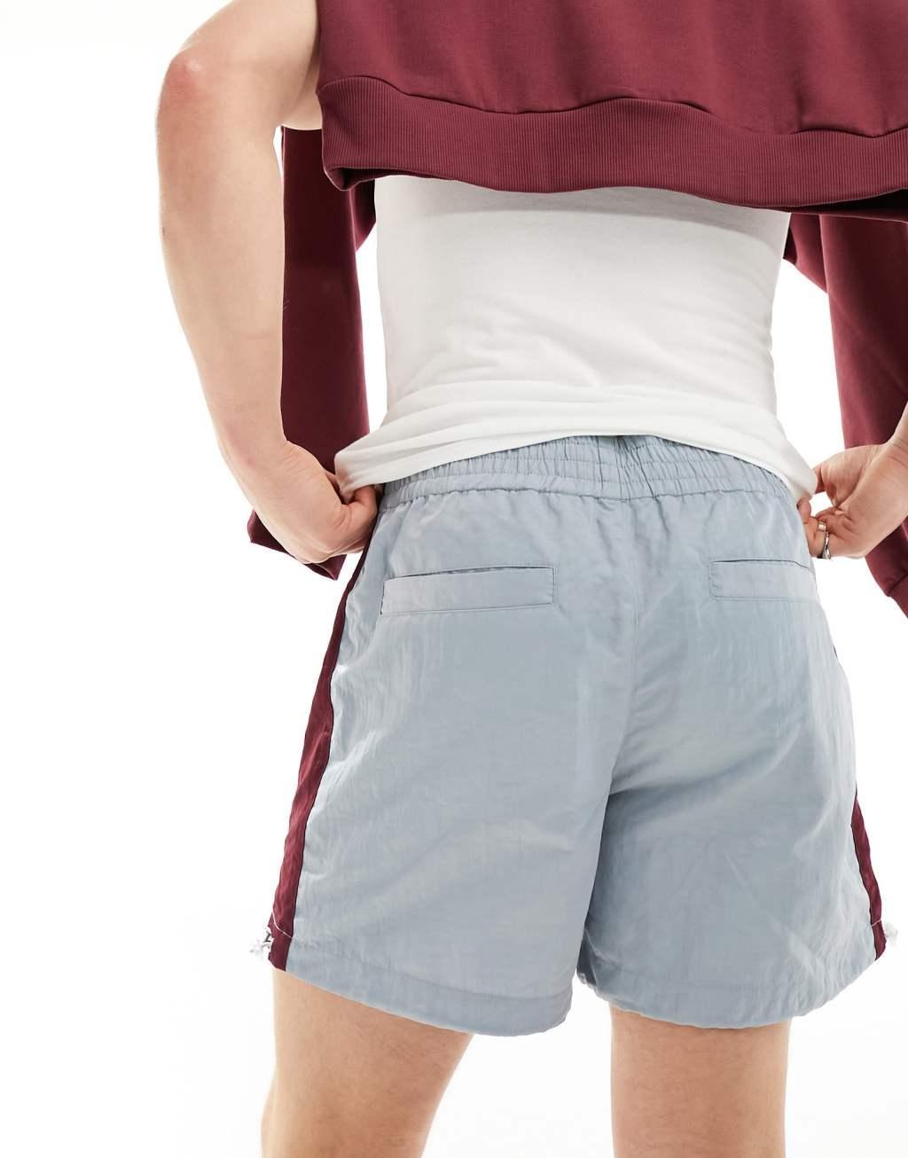 ASOS DESIGN nylon short with side stripe panel and embroidery in blue Product Image