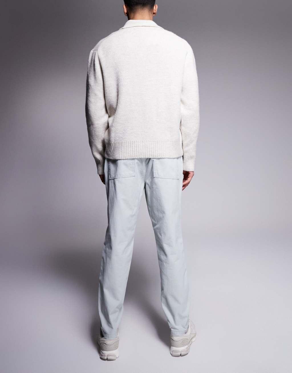ASOS DESIGN tapered pull on pants with back pocket patch in gray Product Image