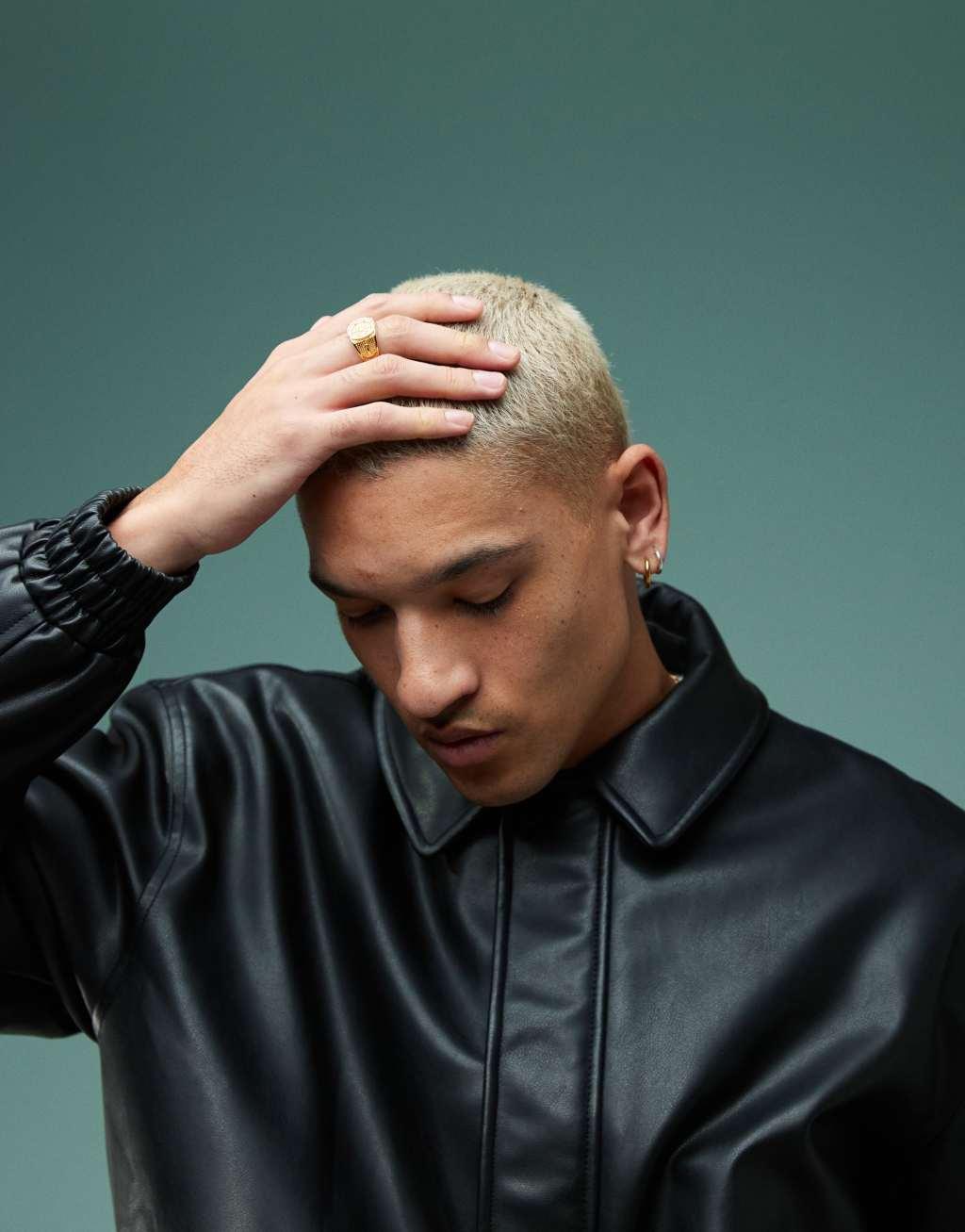 ASOS DESIGN faux leather oversized padded harrington jacket in black Product Image