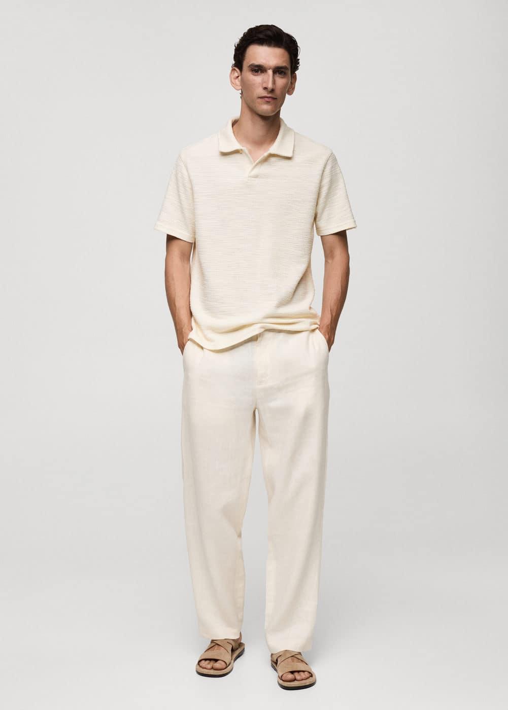 Regular-fit textured knitted polo shirt - Men | MANGO USA Product Image