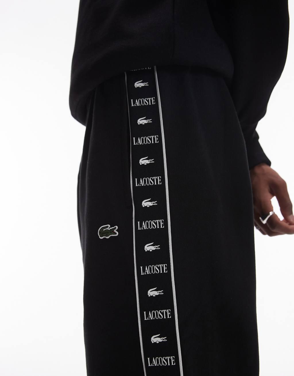 Lacoste logo stripe sweatpants in black  Product Image