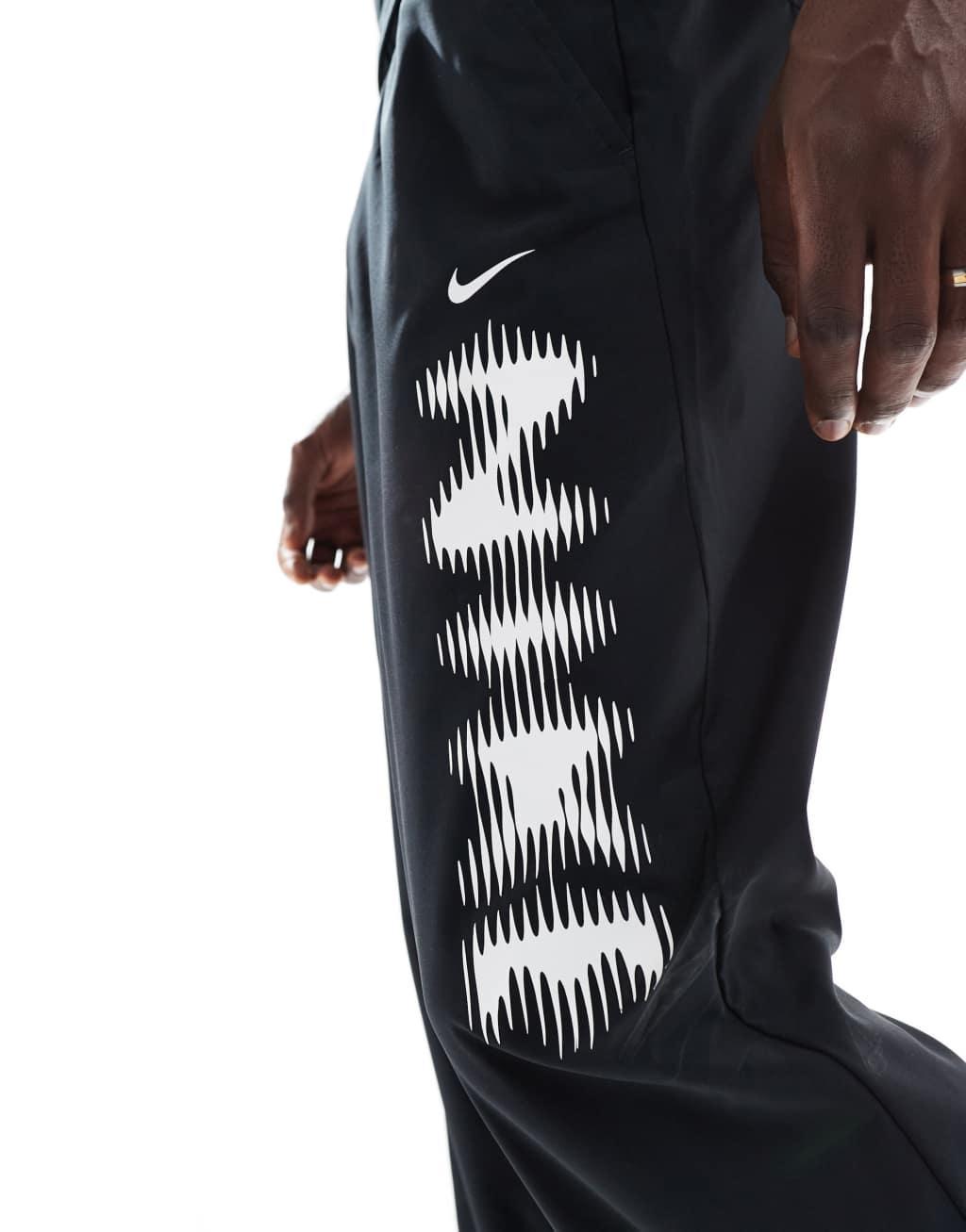 Nike Training blurred swoosh graphic sweatpants in black Product Image