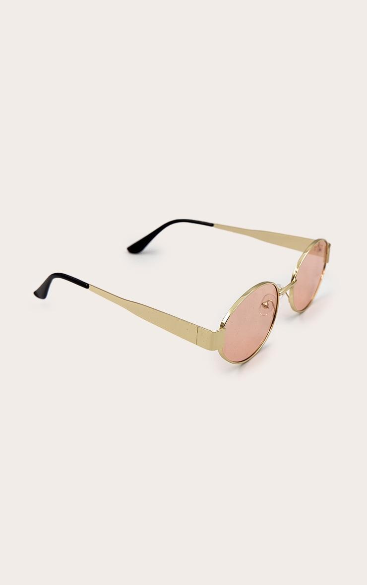 Gold Metal Frame Peach Lens Round Sunglasses Product Image