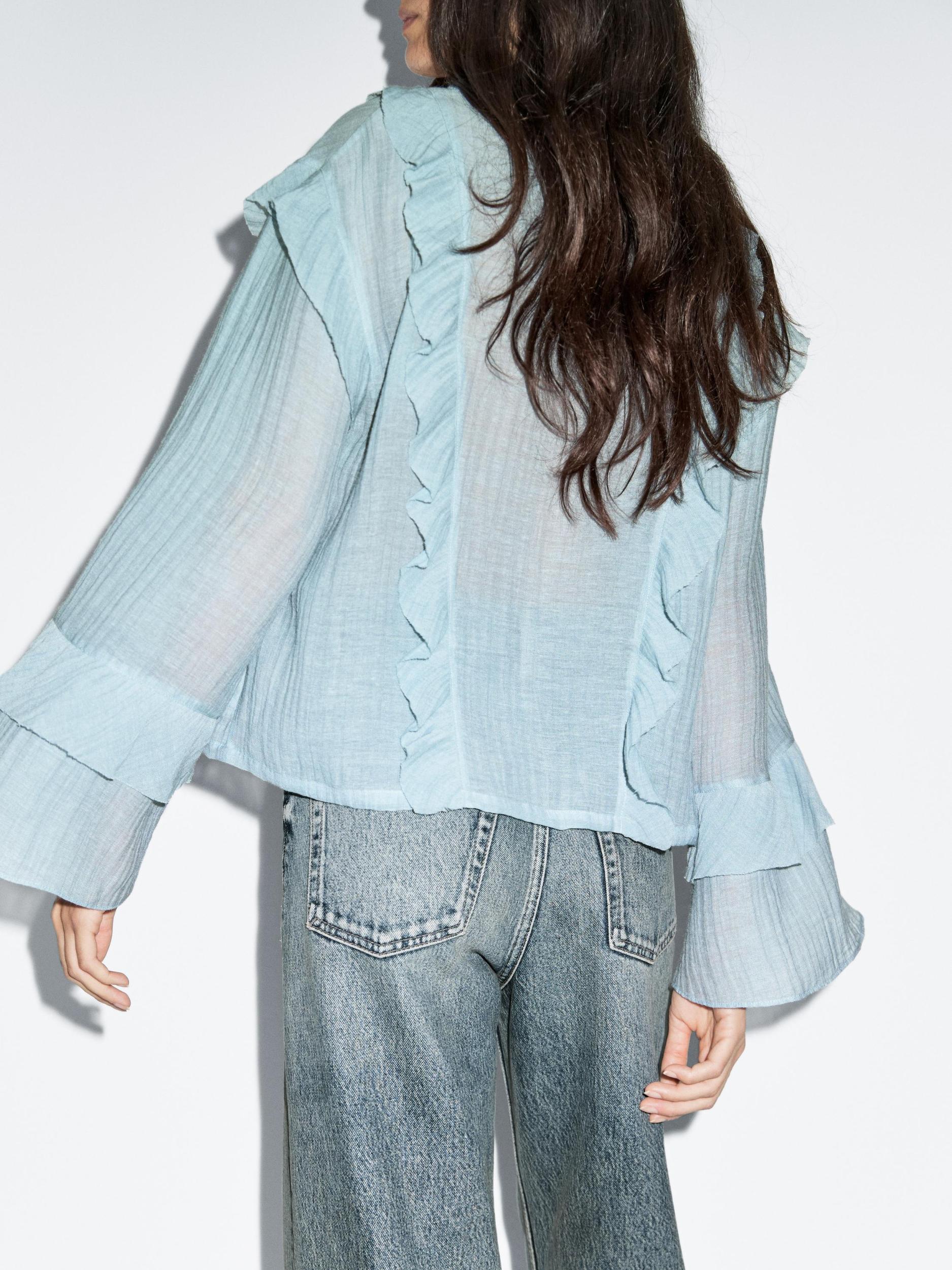 Flowing blouse with ruffles Product Image