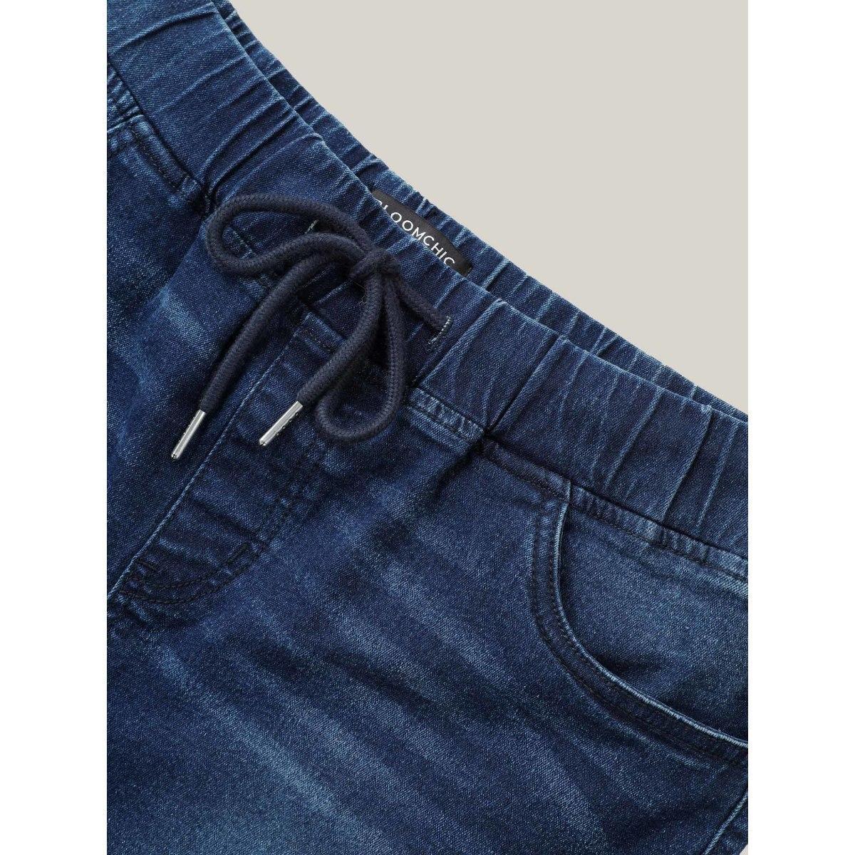 Plus Size Distressed Drawstring Roll Hem Denim Shorts Women Indigo Drawstring High stretch Everyday Slanted pocket Casual Denim Shorts BloomChic 20/2X Product Image