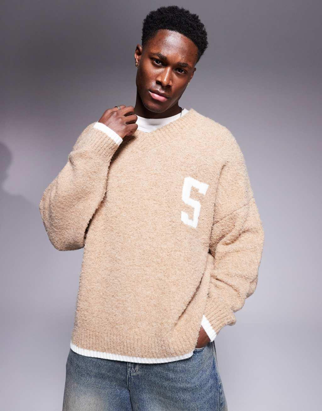 ASOS DESIGN oversized boxy fit textured knit v neck sweater with chest pattern and tipping in beige Product Image