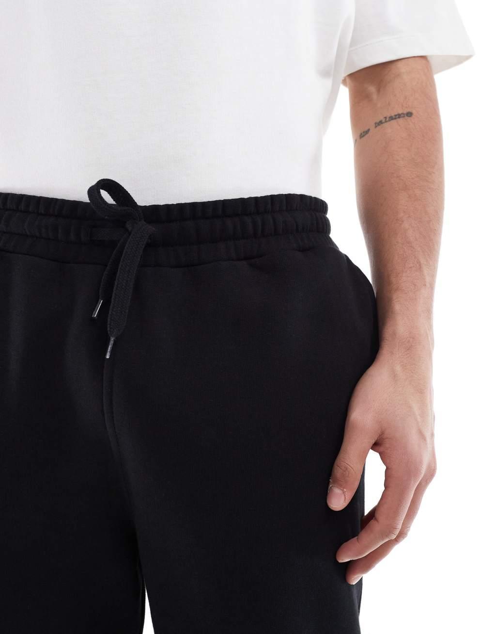 ASOS DESIGN essential skinny sweatpants in black Product Image