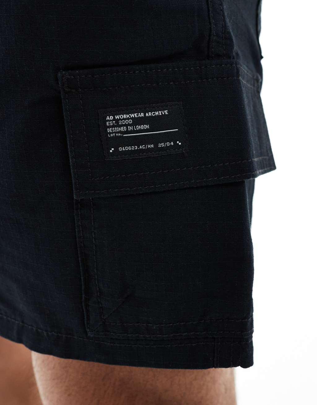ASOS DESIGN slim cargo shorts with patch in black Product Image
