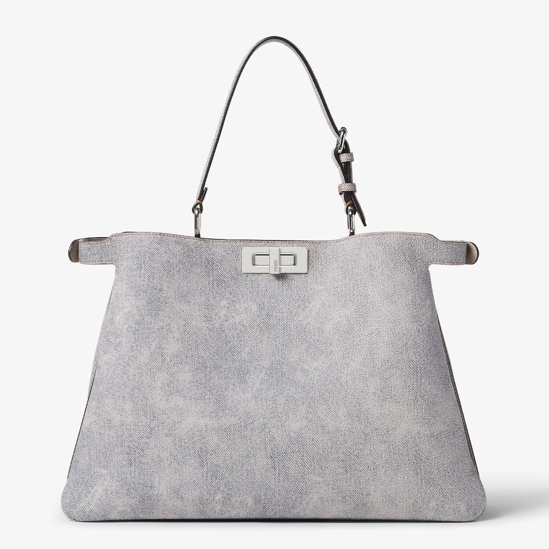 Peekaboo Soft LargeGray leather bag with a faded denim effect. Product Image