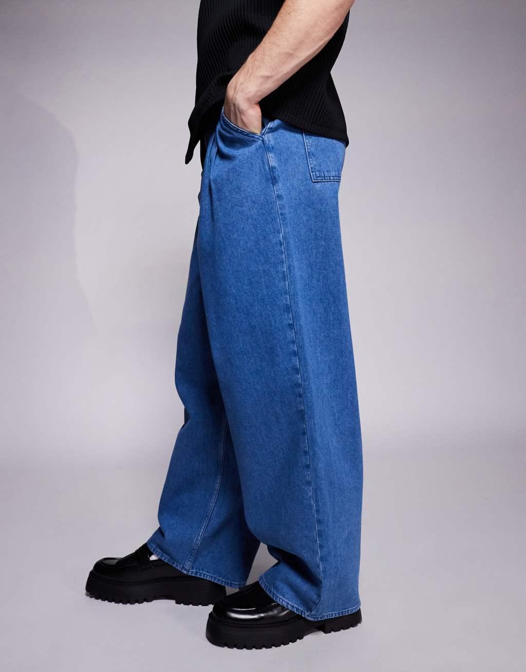ASOS DESIGN oversized baggy jeans with side belts in mid wash blue Product Image