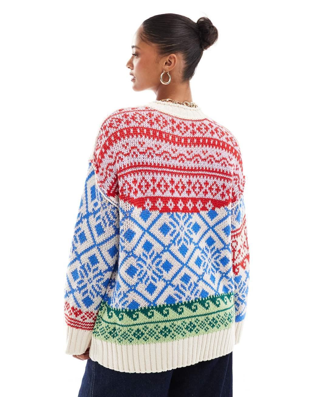 ASOS DESIGN oversized patchwork fairisle festive sweater in blue and red Product Image