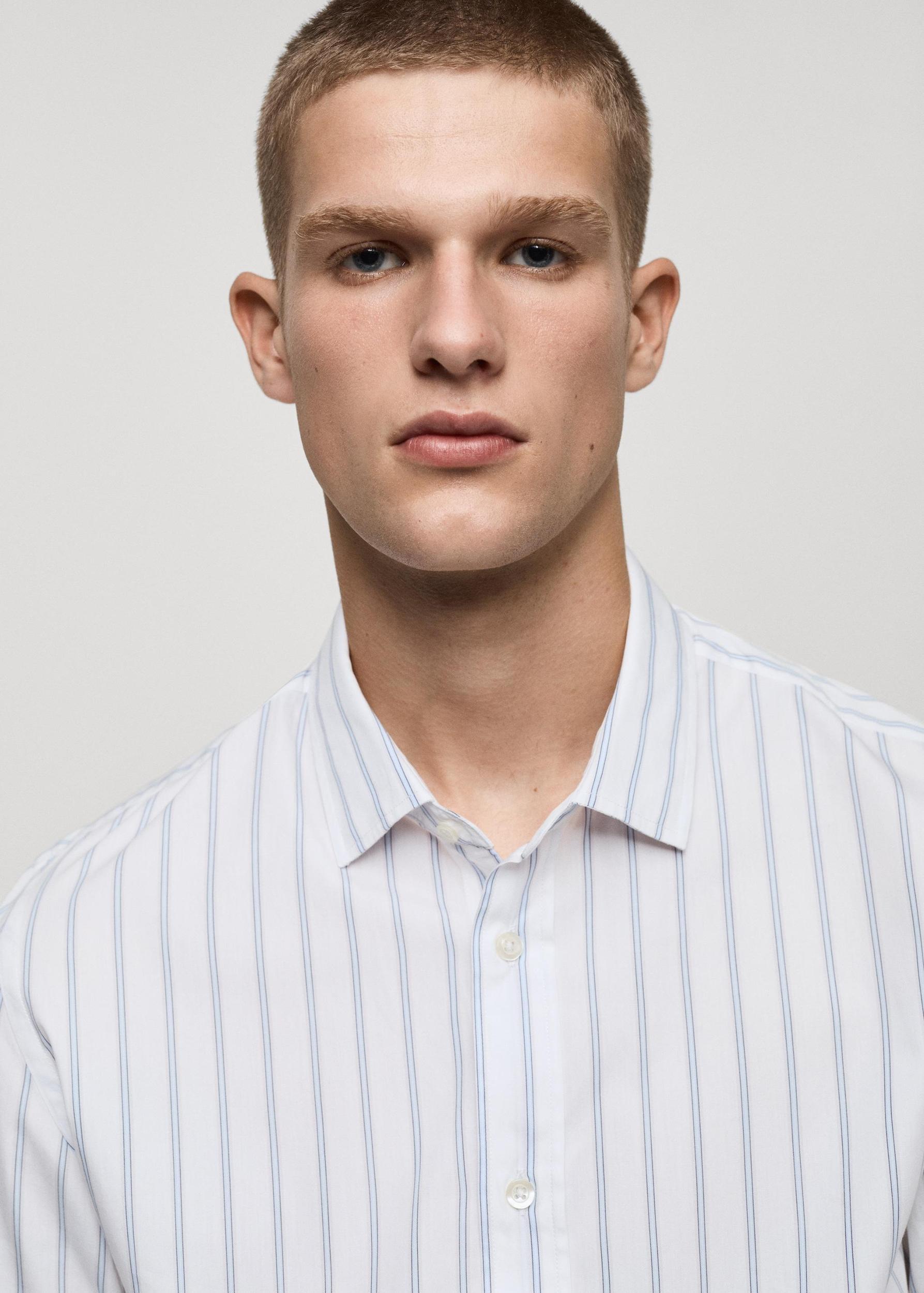 Regular-fit striped cotton shirt - Men | MANGO USA Product Image
