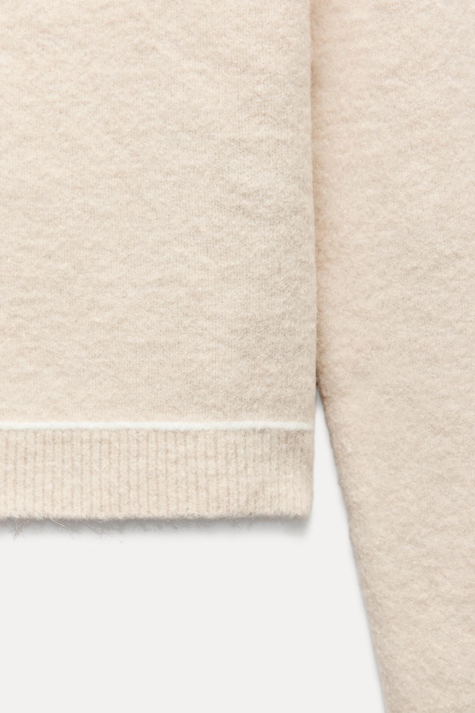 KNIT SWEATER WITH CONTRASTING PIPING Product Image