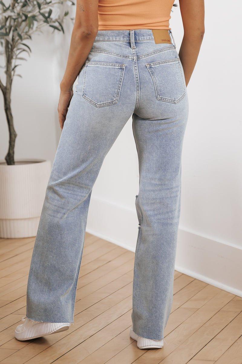 Medium Light Wash Distressed Straight Leg Jeans Product Image