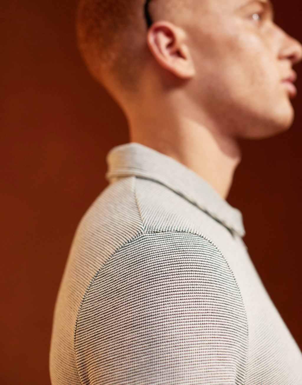 ASOS DESIGN muscle fit polo shirt with zip neck in textured beige Product Image