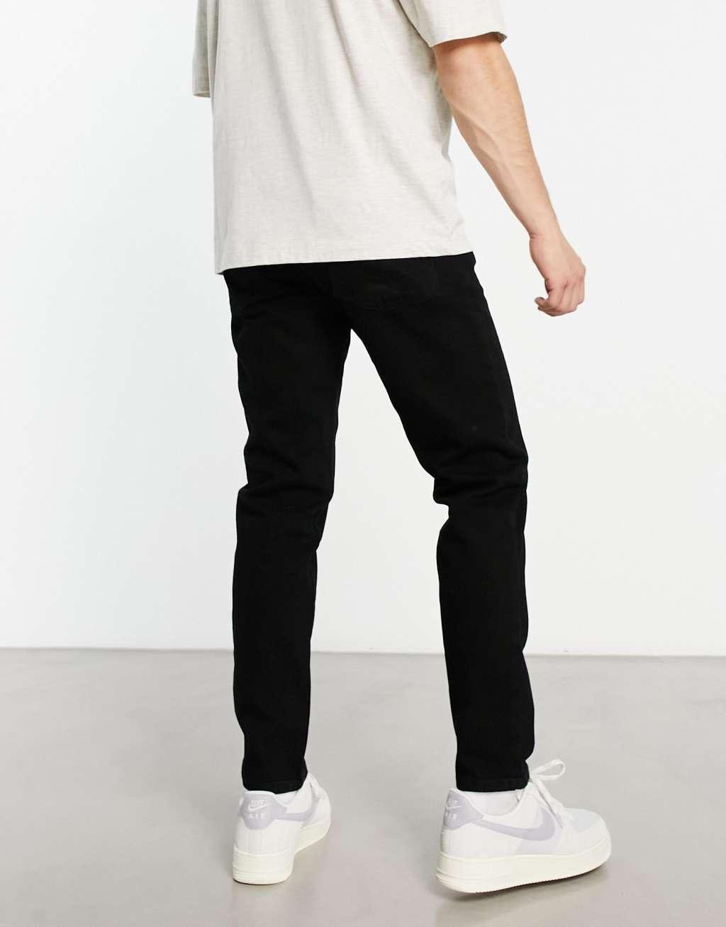 ASOS DESIGN tapered jeans in black Product Image