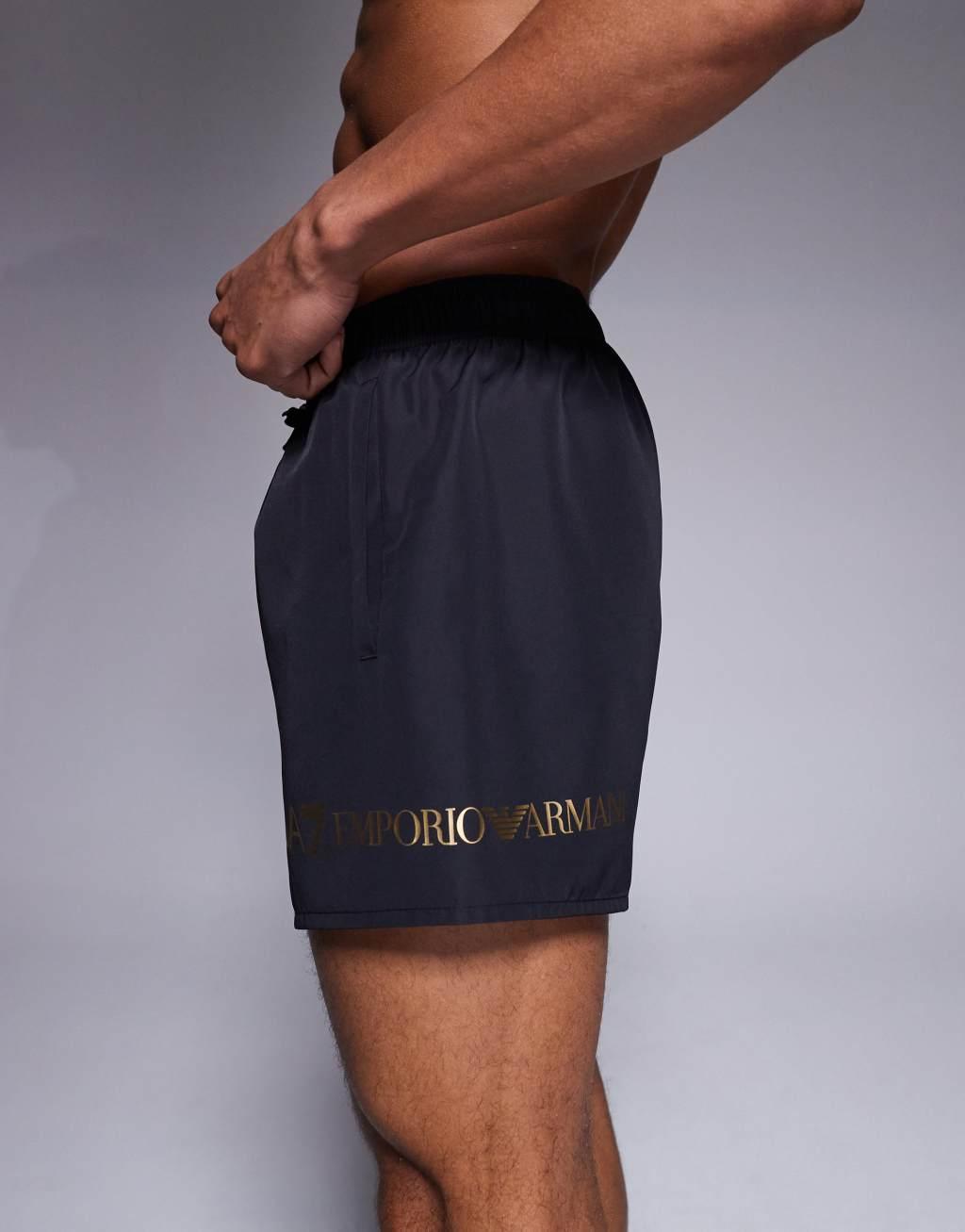 Armani EA7 gold logo swim shorts in black Product Image