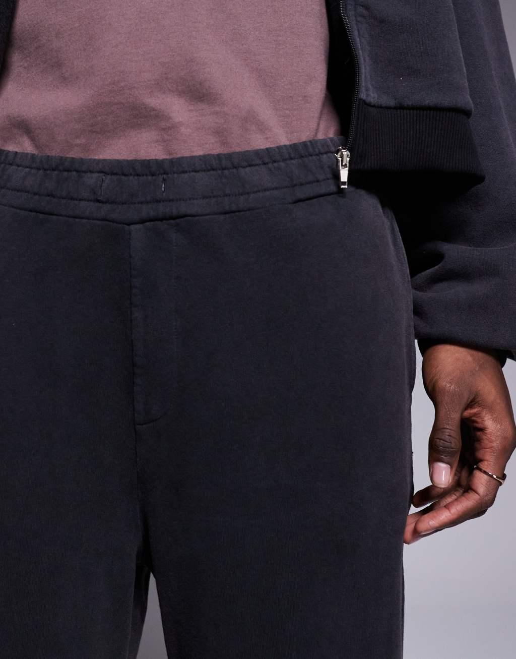 ASOS DESIGN super baggy sweatpants with cuffed hems in washed black Product Image