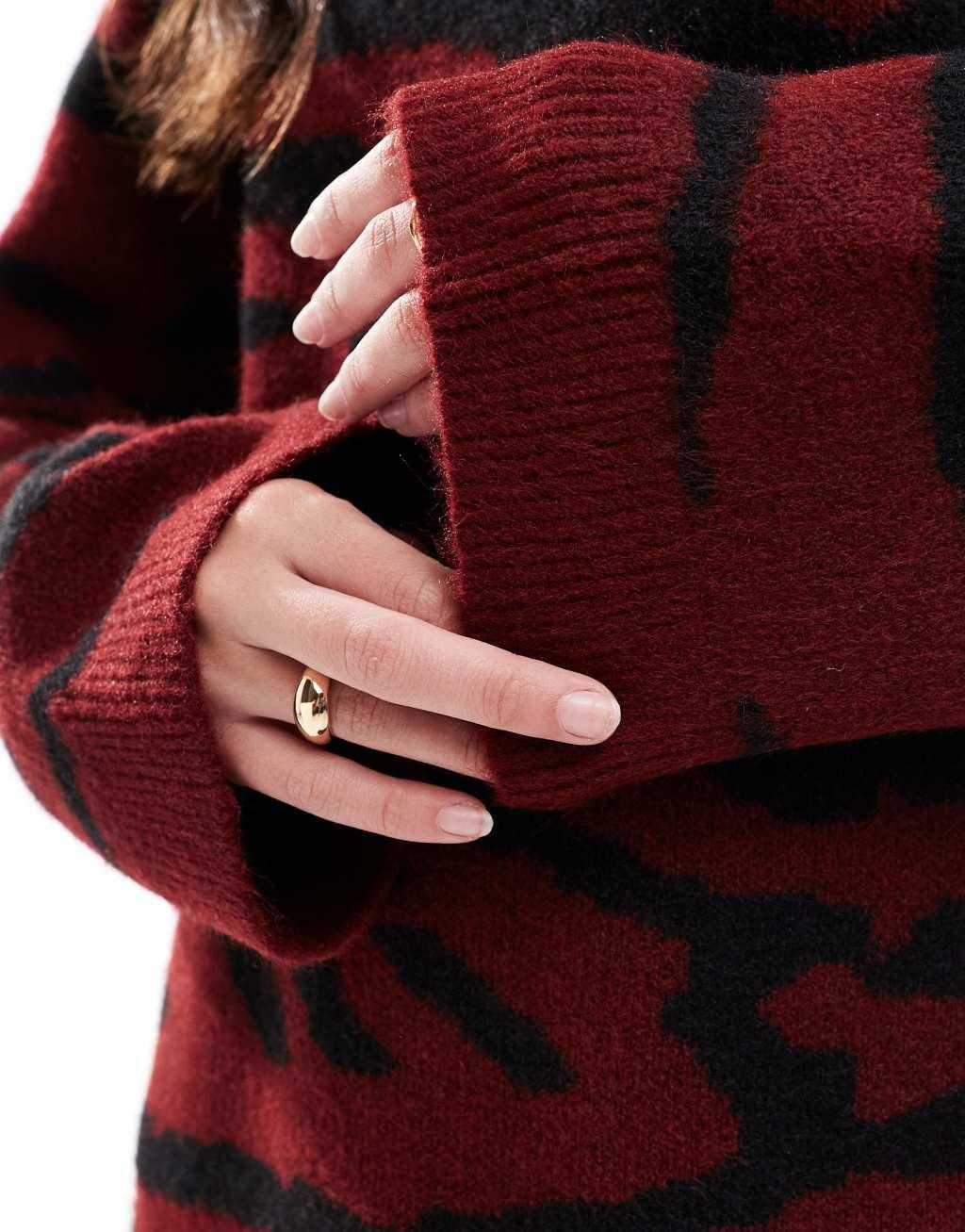 ASOS DESIGN crew neck sweater in burgundy zebra print Product Image