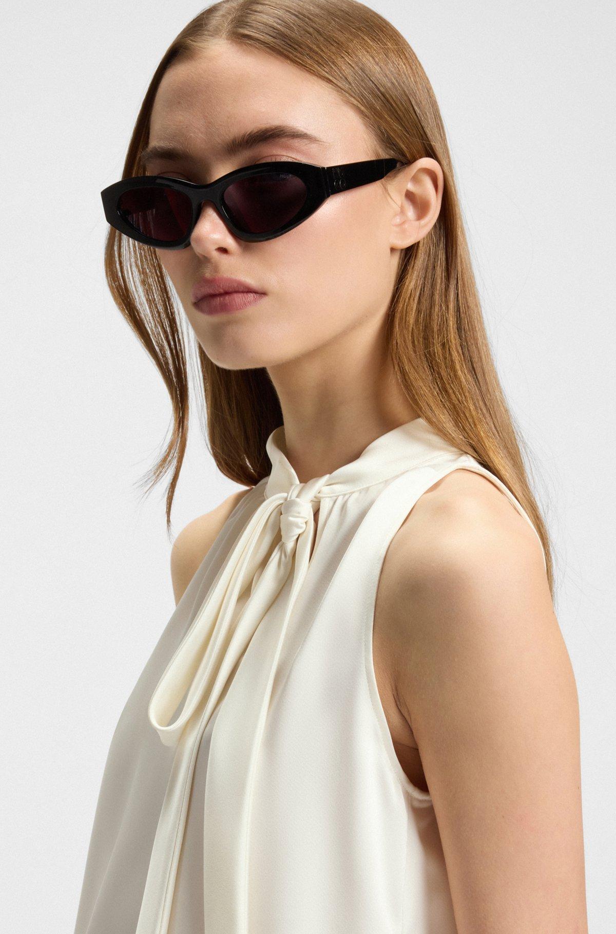 Sleeveless top in satin with tie neck Product Image