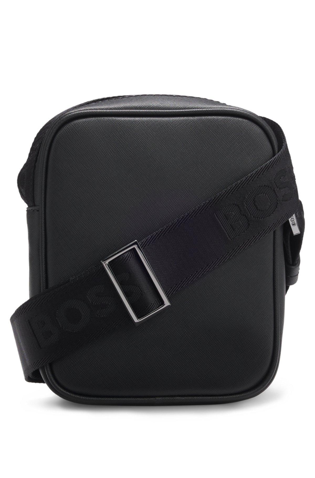 Reporter bag with monogram-patterned front pocket Product Image