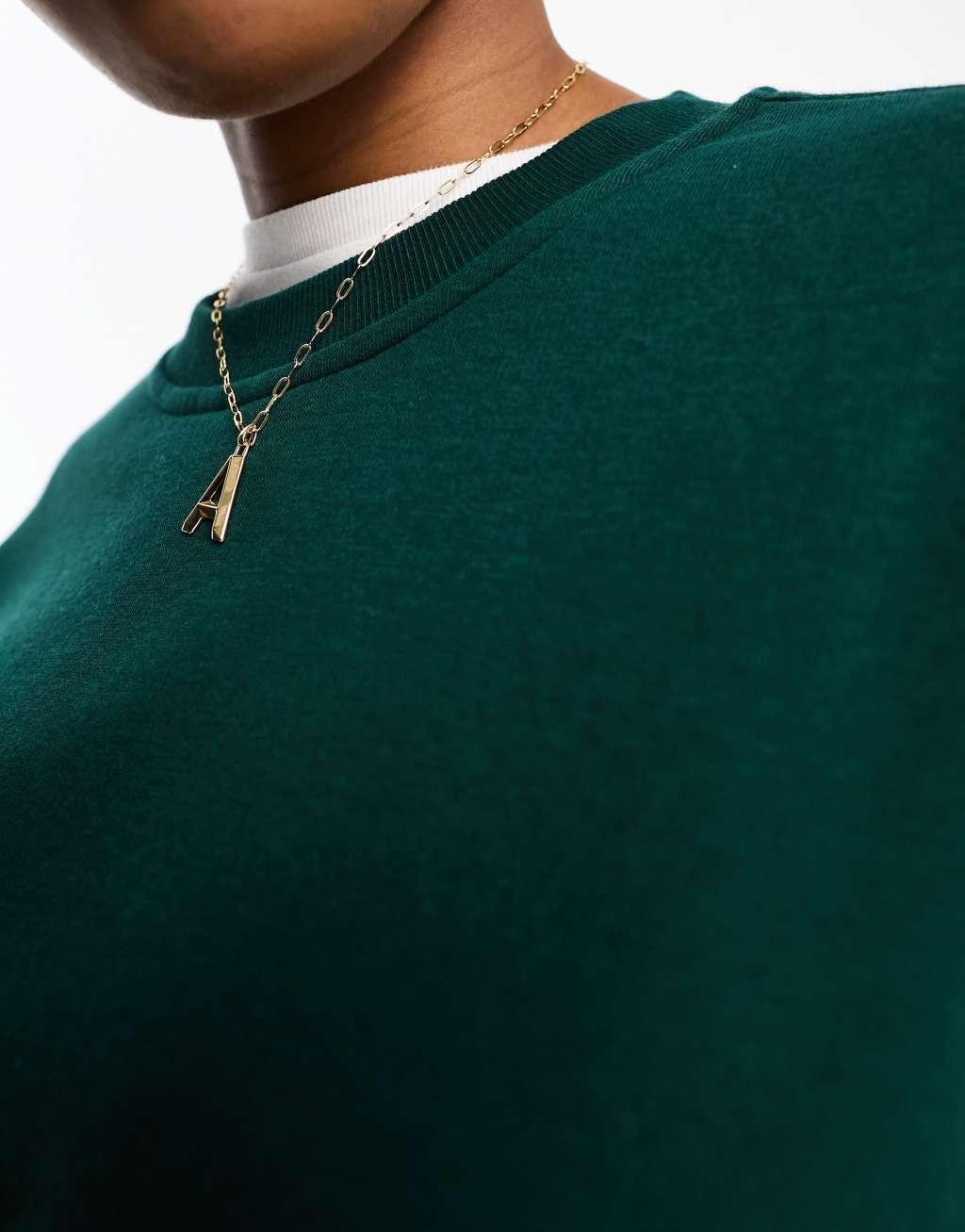 Monki oversized sweatshirt in dark green Product Image