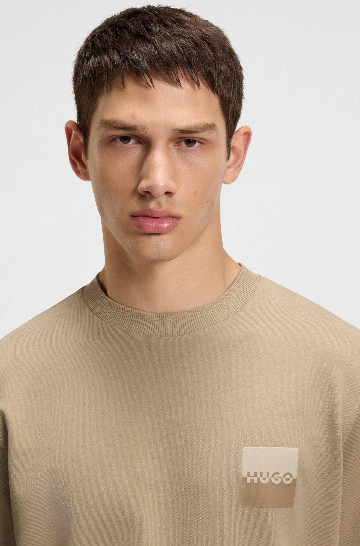 HUGO - Relaxed-fit T-shirt in cotton with split logos - Beige Product Image