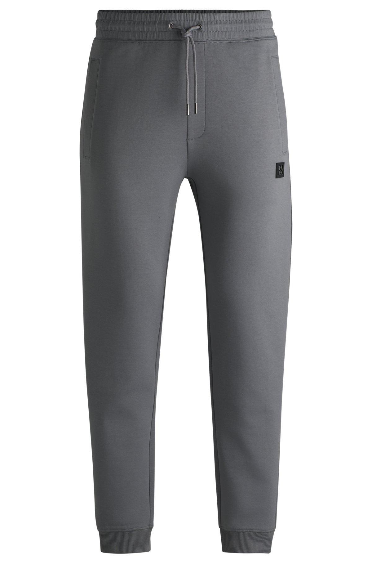 Cotton tracksuit bottoms with stacked logo Product Image