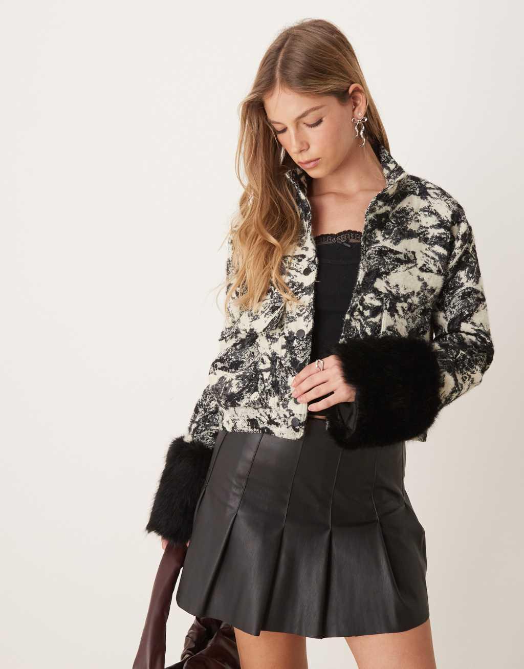 Ghospell faux fur cuff funnel jacket in black and white Product Image
