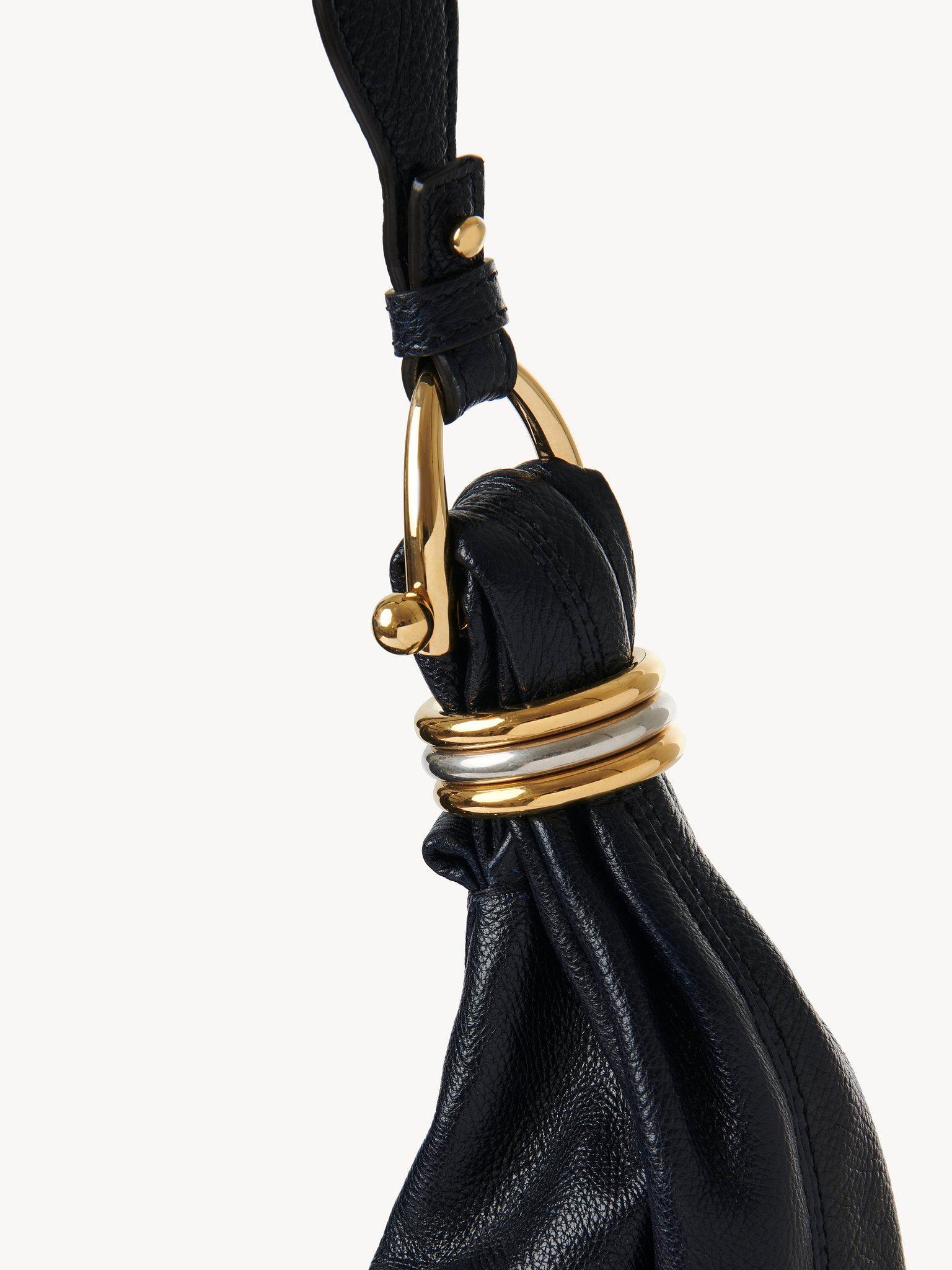 Large Bracelet hobo bag in grained leather with studs Product Image