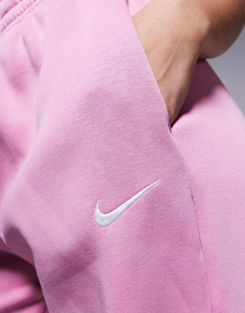 Nike Phoenix Fleece tapered sweatpants in pink Product Image