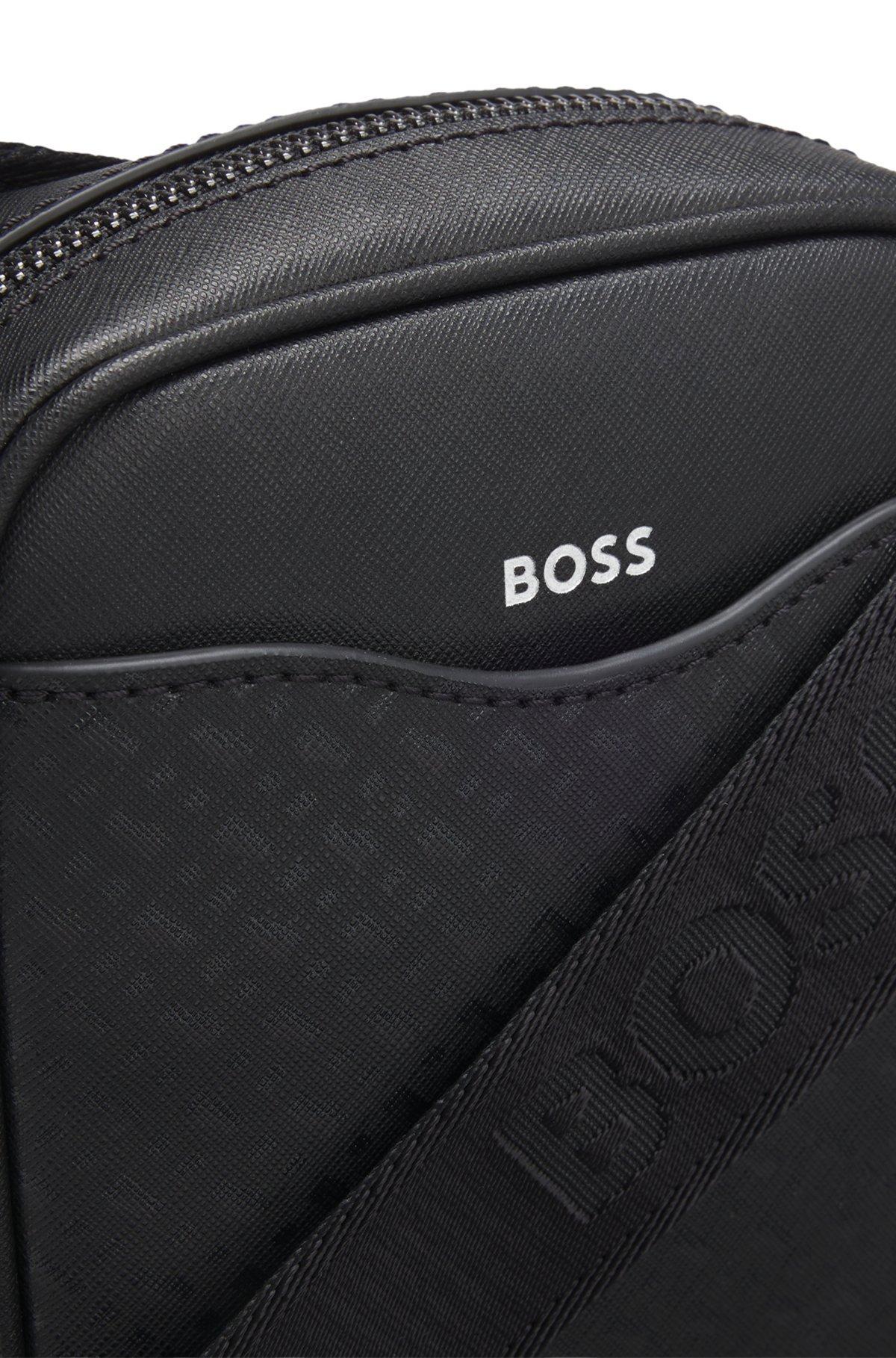 Reporter bag with monogram-patterned front pocket Product Image