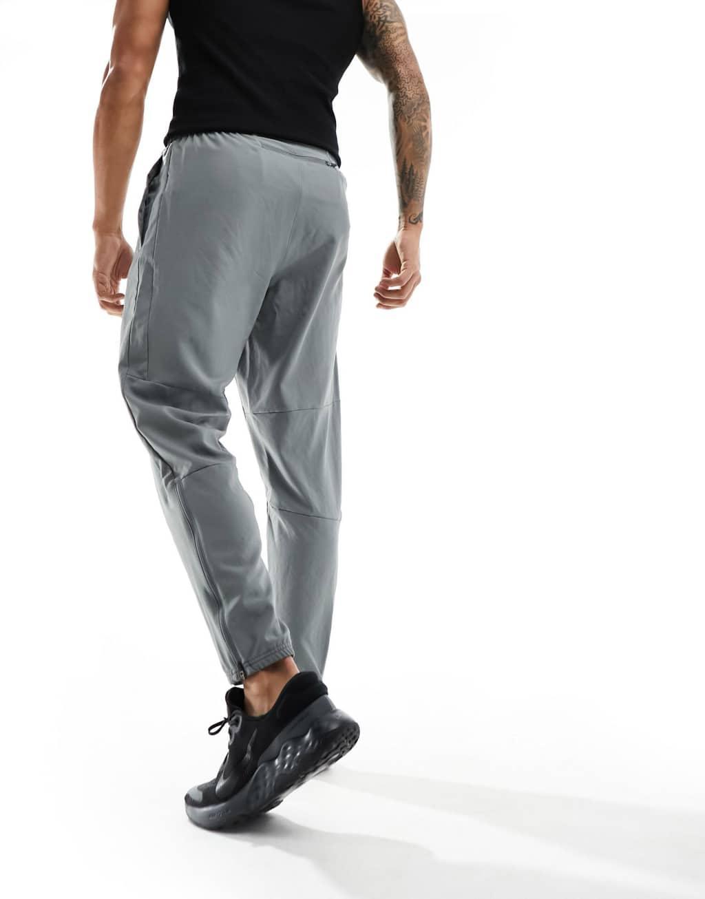 Nike Running Challenger woven sweatpants in gray Product Image